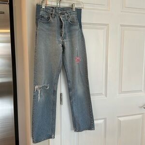 Rare Vintage Levi’s 501 jeans with a butterfly patch.